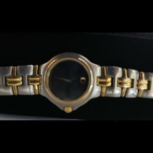 Movado Elegant gold and silver watch. For everyday or dressing things up.